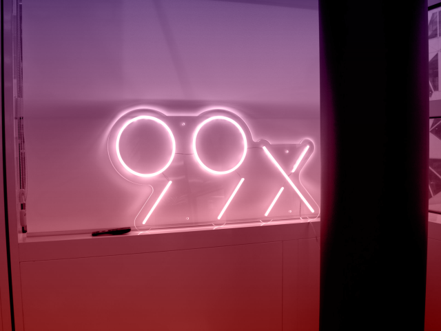 99x logo in the window sill at the office