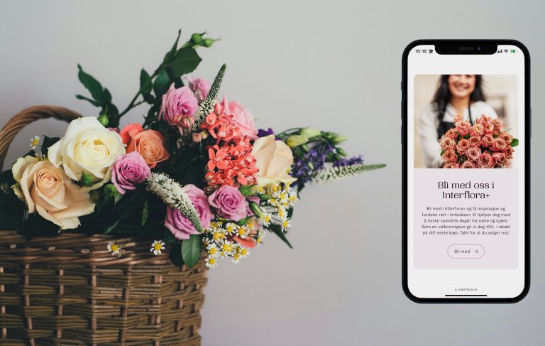 Flowers and a phone with Interflora website view