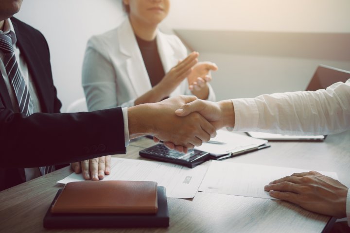 manager-and-employee-interview-concept-with-handsh-2024-12-02-21-23-10-utc