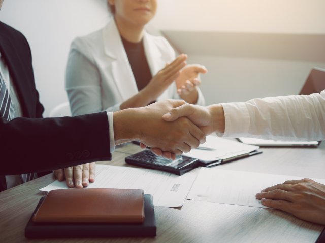 manager-and-employee-interview-concept-with-handsh-2024-12-02-21-23-10-utc